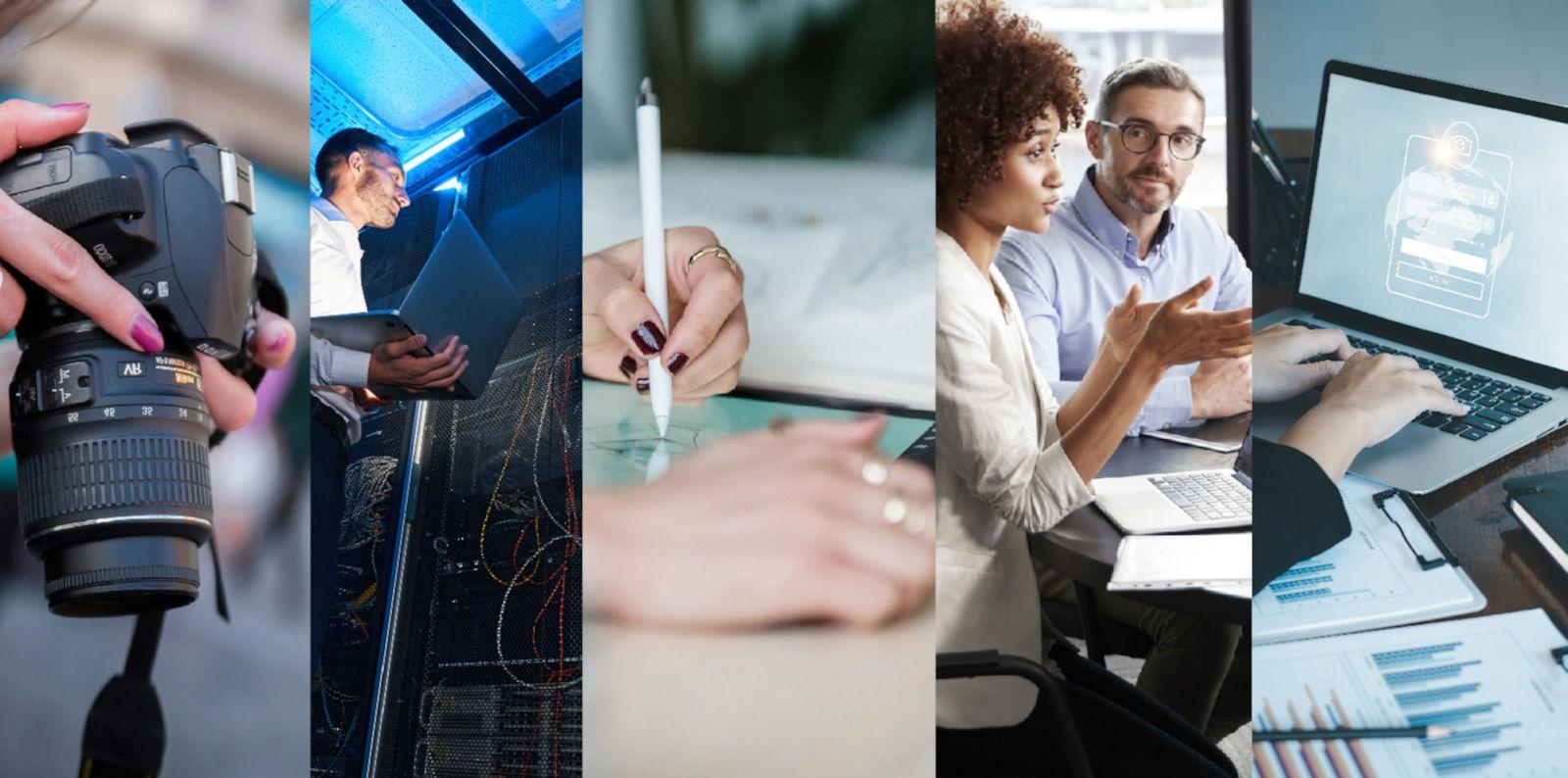 Five individuals composed of two African American males, one African American female, a Caucasian male, and a Caucasian female wear business casual clothes and sit around a round table discussing business using computers and paperwork.